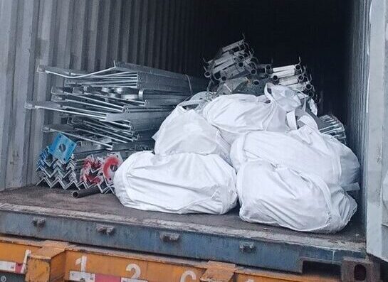 The angle steel tower is loaded into a container and shipped to Tianjin Port